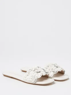 Mules Stuart Weitzman in pelle con fiori applicati