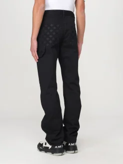 Jeans Amiri in denim con motivo monogram