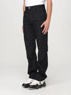 Jeans Amiri in denim con motivo monogram