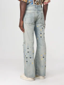 Jeans con logo all-over Amiri
