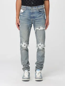 Jeans con rotture e toppe stampate Amiri