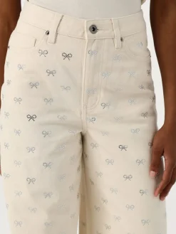 Jeans Self-Portrait in denim con fiocchi di strass