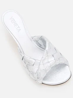 Mules Blink Bottega Veneta in pelle laminata intrecciata
