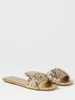 Mules Stuart Weitzman in pelle laminata con fiori applicati