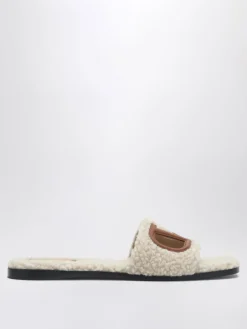 Mules VLogo Signature Valentino Garavani in shearling e pelle
