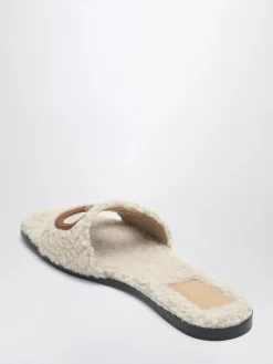Mules VLogo Signature Valentino Garavani in shearling e pelle