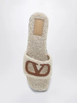 Mules VLogo Signature Valentino Garavani in shearling e pelle