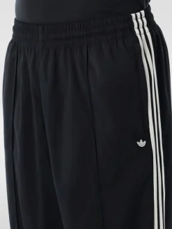 Pantalone Adidas Originals in tessuto tecnico stretch