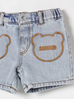 Shorts di jeans con toppe Teddy Moschino